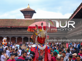 Nepali devotees carry the statues of Dipankar Buddha through the ancient city of Bhaktapur in Bhaktapur, Nepal, on August 31, 2024, during t...