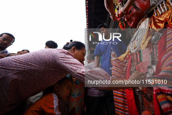 A Nepali devotee worships the statues of Dipankar Buddha during the Panchadan festival in Bhaktapur, Nepal, on August 31, 2024. On this day,...