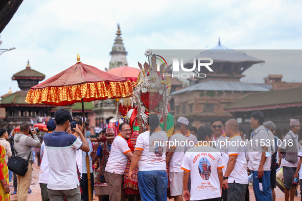 Nepali devotees carry the statues of Dipankar Buddha through the ancient city of Bhaktapur in Bhaktapur, Nepal, on August 31, 2024, during t...