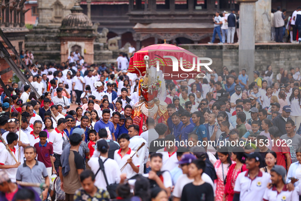 Nepali devotees carry the statues of Dipankar Buddha through the ancient city of Bhaktapur in Bhaktapur, Nepal, on August 31, 2024, during t...