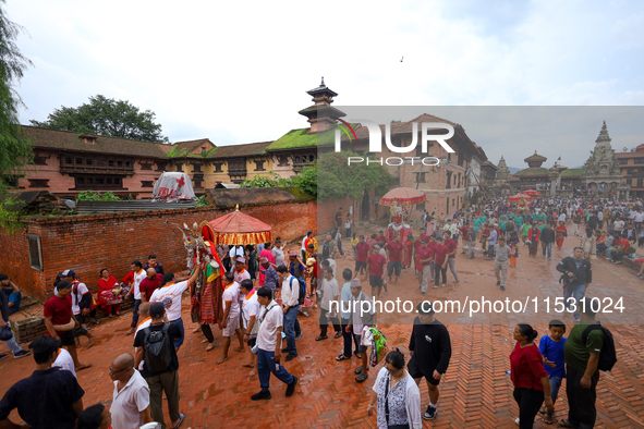 Nepali devotees carry the statues of Dipankar Buddha through the ancient city of Bhaktapur in Bhaktapur, Nepal, on August 31, 2024, during t...