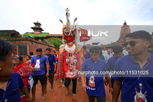 Nepali devotees carry the statues of Dipankar Buddha through the ancient city of Bhaktapur in Bhaktapur, Nepal, on August 31, 2024, during t...