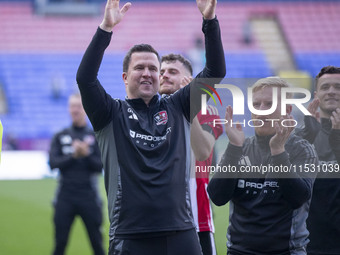 Exeter City F.C. manager Gary Caldwell celebrates at full time during the Sky Bet League 1 match between Bolton Wanderers and Exeter City at...