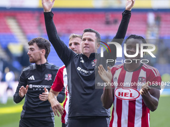 Exeter City F.C. manager Gary Caldwell celebrates at full time during the Sky Bet League 1 match between Bolton Wanderers and Exeter City at...