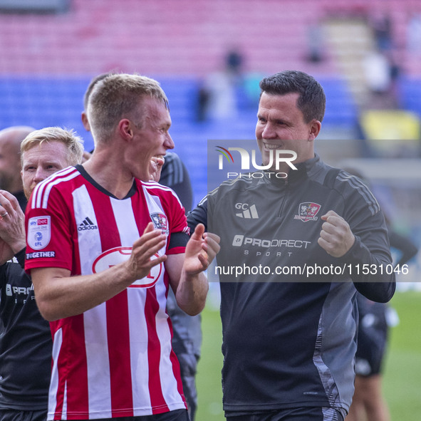 Exeter City F.C. manager Gary Caldwell celebrates at full time during the Sky Bet League 1 match between Bolton Wanderers and Exeter City at...