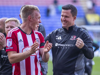 Exeter City F.C. manager Gary Caldwell celebrates at full time during the Sky Bet League 1 match between Bolton Wanderers and Exeter City at...