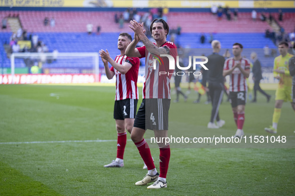 Tristan Crama #4 of Exeter City F.C. celebrates at full time during the Sky Bet League 1 match between Bolton Wanderers and Exeter City at t...