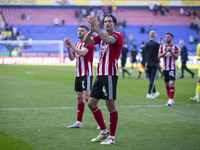 Tristan Crama #4 of Exeter City F.C. celebrates at full time during the Sky Bet League 1 match between Bolton Wanderers and Exeter City at t...