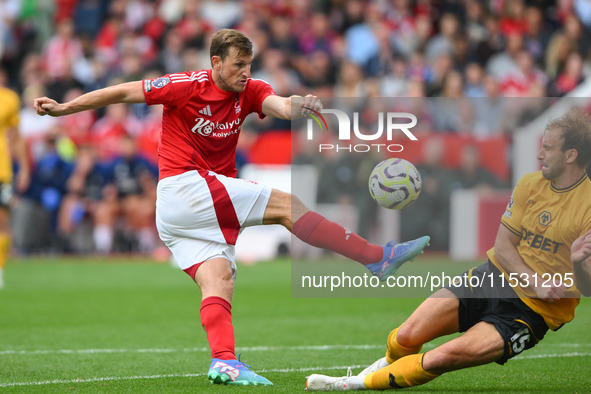 Craig Dawson of Wolverhampton Wanderers blocks a shot from Chris Wood of Nottingham Forest during the Premier League match between Nottingha...