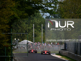 Carlos Sainz of Scuderia Ferrari and Charles Leclerc of Scuderia Ferrari drive their single-seaters during qualifying of the Italian GP, the...