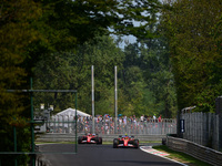 Carlos Sainz of Scuderia Ferrari and Charles Leclerc of Scuderia Ferrari drive their single-seaters during qualifying of the Italian GP, the...