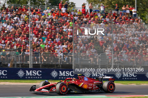 Carlos Sainz Jr. of Spain drives the (55) Scuderia Ferrari SF-24 Ferrari during the Formula 1 Pirelli Gran Premio d'Italia 2024 in Monza, It...