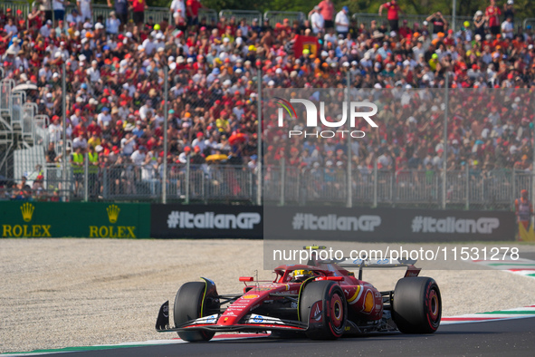 Carlos Sainz Jr. of Spain drives the (55) Scuderia Ferrari SF-24 Ferrari during the Formula 1 Pirelli Gran Premio d'Italia 2024 in Monza, It...