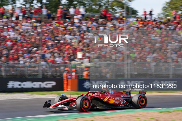 Carlos Sainz Jr. of Spain drives the (55) Scuderia Ferrari SF-24 Ferrari during the Formula 1 Pirelli Gran Premio d'Italia 2024 in Monza, It...