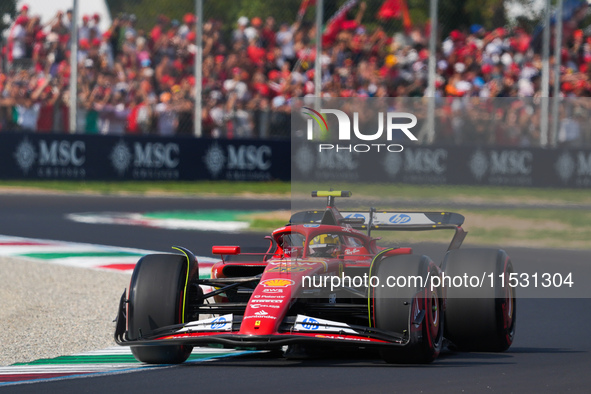 Carlos Sainz Jr. of Spain drives the (55) Scuderia Ferrari SF-24 Ferrari during the Formula 1 Pirelli Gran Premio d'Italia 2024 in Monza, It...