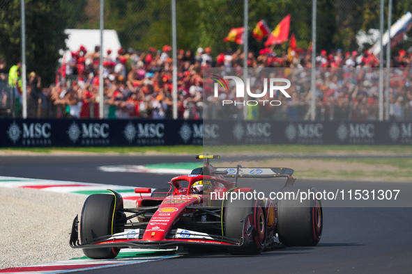 Carlos Sainz Jr. of Spain drives the (55) Scuderia Ferrari SF-24 Ferrari during the Formula 1 Pirelli Gran Premio d'Italia 2024 in Monza, It...