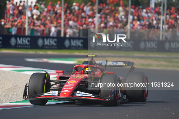 Carlos Sainz Jr. of Spain drives the (55) Scuderia Ferrari SF-24 Ferrari during the Formula 1 Pirelli Gran Premio d'Italia 2024 in Monza, It...