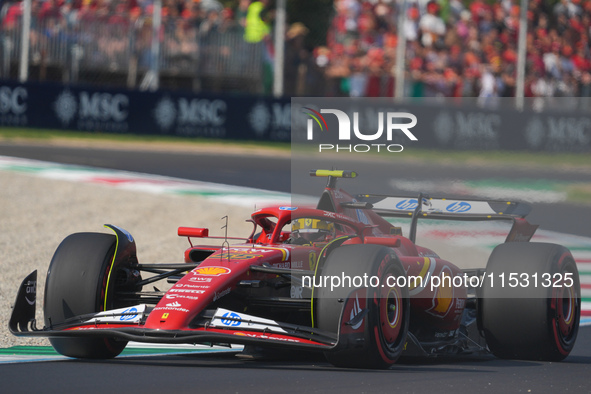 Carlos Sainz Jr. of Spain drives the (55) Scuderia Ferrari SF-24 Ferrari during the Formula 1 Pirelli Gran Premio d'Italia 2024 in Monza, It...