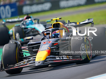 Sergio Perez of Mexico drives the (11) Oracle Red Bull Racing RB20 during FP3 of the Formula 1 Pirelli Gran Premio d'Italia 2024 in Monza, I...