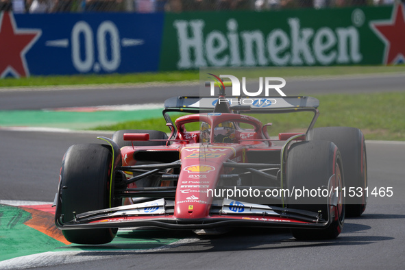 Carlos Sainz Jr. of Spain drives the (55) Scuderia Ferrari SF-24 Ferrari during the Formula 1 Pirelli Gran Premio d'Italia 2024 in Monza, It...