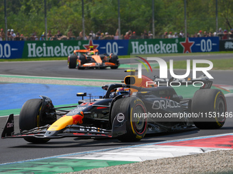 Sergio Perez of Mexico drives the (11) Oracle Red Bull Racing RB20 Honda RBPT during the Formula 1 Pirelli Gran Premio d'Italia 2024 in Monz...