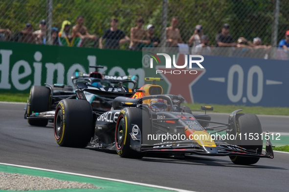 Sergio Perez of Mexico drives the (11) Oracle Red Bull Racing RB20 Honda RBPT during the Formula 1 Pirelli Gran Premio d'Italia 2024 in Monz...