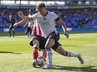 Dion Charles #10 of Bolton Wanderers F.C. tackles the opponent during the Sky Bet League 1 match between Bolton Wanderers and Exeter City at...