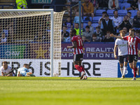 Millenic Alli #11 of Exeter City F.C. celebrates his goal during the Sky Bet League 1 match between Bolton Wanderers and Exeter City at the...