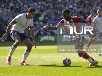 Millenic Alli #11 of Exeter City F.C. is in possession of the ball during the Sky Bet League 1 match between Bolton Wanderers and Exeter Cit...