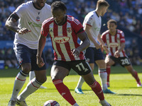 Millenic Alli #11 of Exeter City F.C. is in possession of the ball during the Sky Bet League 1 match between Bolton Wanderers and Exeter Cit...