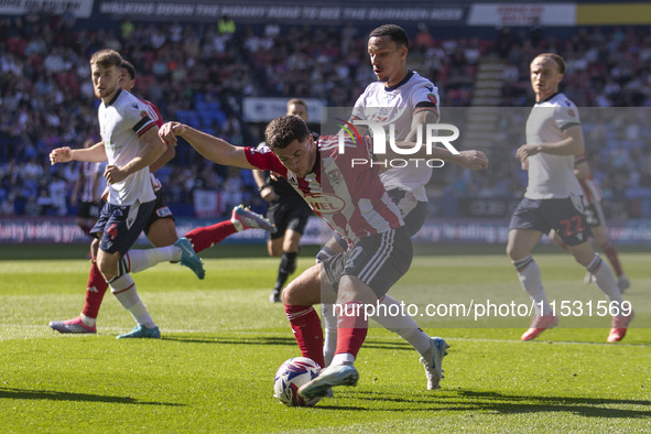 Jack Aitchison #10 of Exeter City F.C. crosses during the Sky Bet League 1 match between Bolton Wanderers and Exeter City at the Toughsheet...