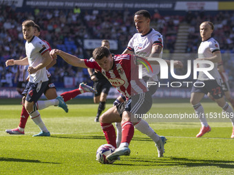 Jack Aitchison #10 of Exeter City F.C. crosses during the Sky Bet League 1 match between Bolton Wanderers and Exeter City at the Toughsheet...