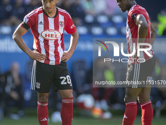 Kamari Doyle #20 of Exeter City F.C. prepares to take the free-kick during the Sky Bet League 1 match between Bolton Wanderers and Exeter Ci...