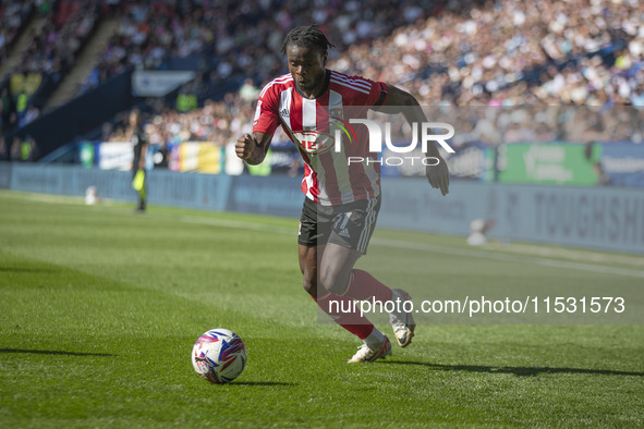 Millenic Alli #11 of Exeter City F.C. during the Sky Bet League 1 match between Bolton Wanderers and Exeter City at the Toughsheet Stadium i...