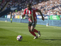 Millenic Alli #11 of Exeter City F.C. during the Sky Bet League 1 match between Bolton Wanderers and Exeter City at the Toughsheet Stadium i...