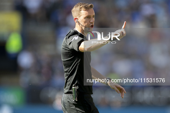 Referee Ben Toner gesticulates during the Sky Bet League 1 match between Bolton Wanderers and Exeter City at the Toughsheet Stadium in Bolto...