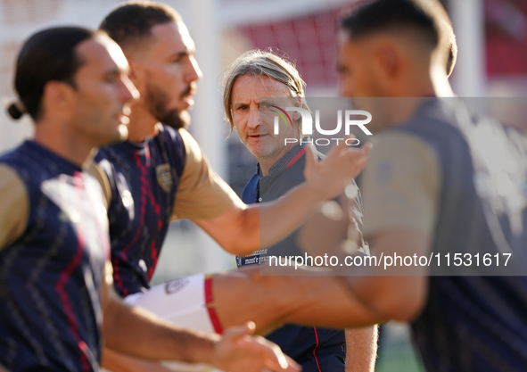 Davide Nicola, head coach of Cagliari Calcio, watches the Serie A match between Lecce and Cagliari in Lecce, Italy, on August 31, 2024. 