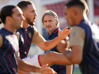 Davide Nicola, head coach of Cagliari Calcio, watches the Serie A match between Lecce and Cagliari in Lecce, Italy, on August 31, 2024. (