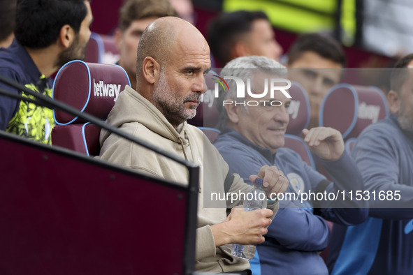 Pep Guardiola of Manchester City during the Premier League match between West Ham United and Manchester City at the London Stadium in Stratf...