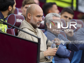 Pep Guardiola of Manchester City during the Premier League match between West Ham United and Manchester City at the London Stadium in Stratf...