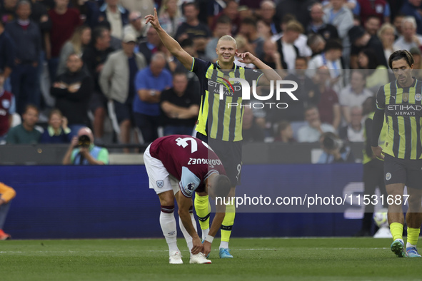 Erling Haaland of Manchester City celebrates his second goal during the Premier League match between West Ham United and Manchester City at...