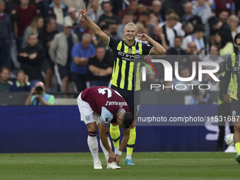 Erling Haaland of Manchester City celebrates his second goal during the Premier League match between West Ham United and Manchester City at...