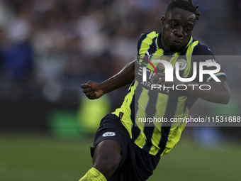 Jeremy Doku of Manchester City is on the ball during the Premier League match between West Ham United and Manchester City at the London Stad...