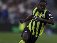 Jeremy Doku of Manchester City is on the ball during the Premier League match between West Ham United and Manchester City at the London Stad...