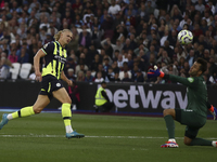 Erling Haaland of Manchester City scores his third goal during the Premier League match between West Ham United and Manchester City at the L...