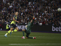 Erling Haaland of Manchester City scores his third goal during the Premier League match between West Ham United and Manchester City at the L...