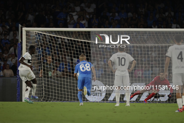 Parma's Ange-Yoan Bonny scores their first goal on a penalty during the Serie A soccer match between SSC Napoli and Parma Calcio at Stadio M...