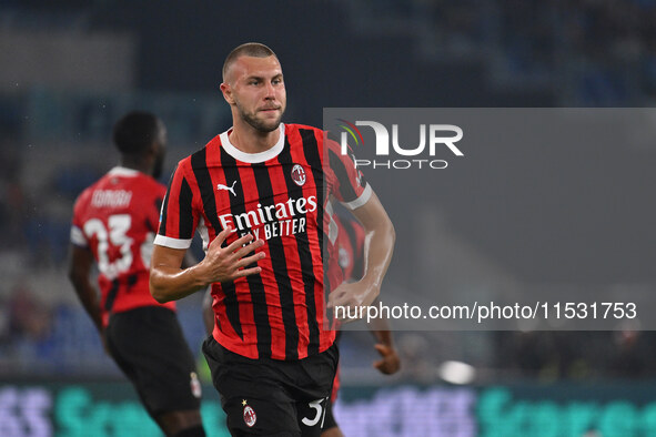 Strahinja Pavlovic of A.C. Milan celebrates after scoring the goal of 0-1 during the 3rd day of the Serie A Championship between S.S. Lazio...