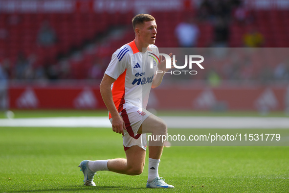 Elliott Anderson of Nottingham Forest warms up ahead of kick-off during the Premier League match between Nottingham Forest and Wolverhampton...