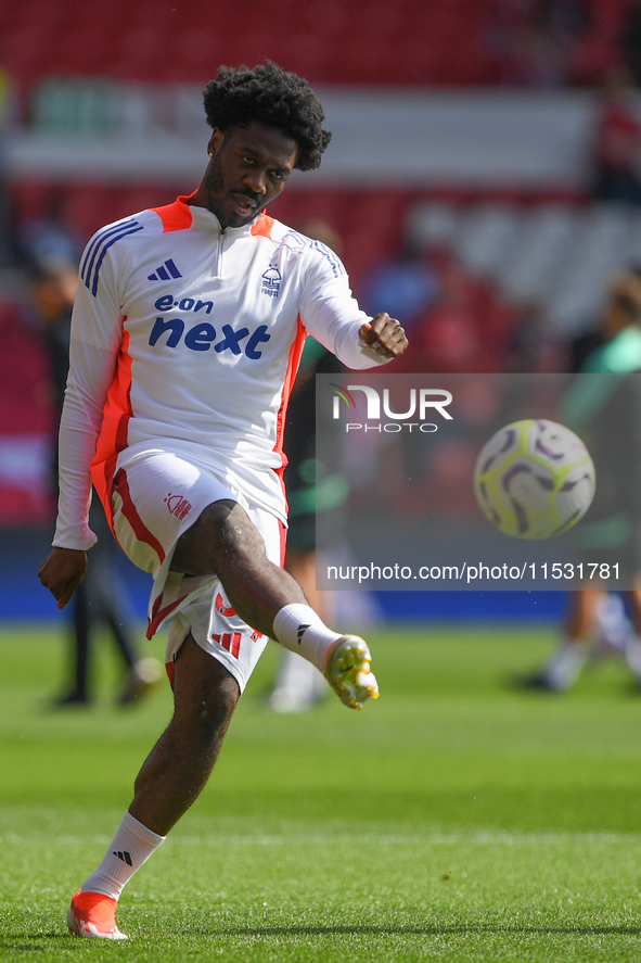 Ola Aina of Nottingham Forest warms up ahead of kick-off during the Premier League match between Nottingham Forest and Wolverhampton Wandere...